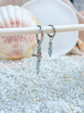 Light blue seahorse earrings in silver